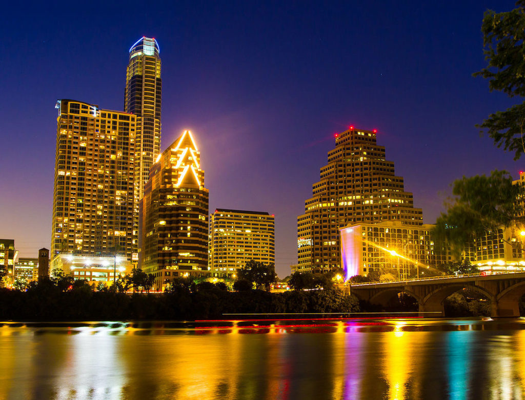 the Light of Downtown Austin from the Hyatt Regency across Ladybird Lake. Licensed with Creative Commons.