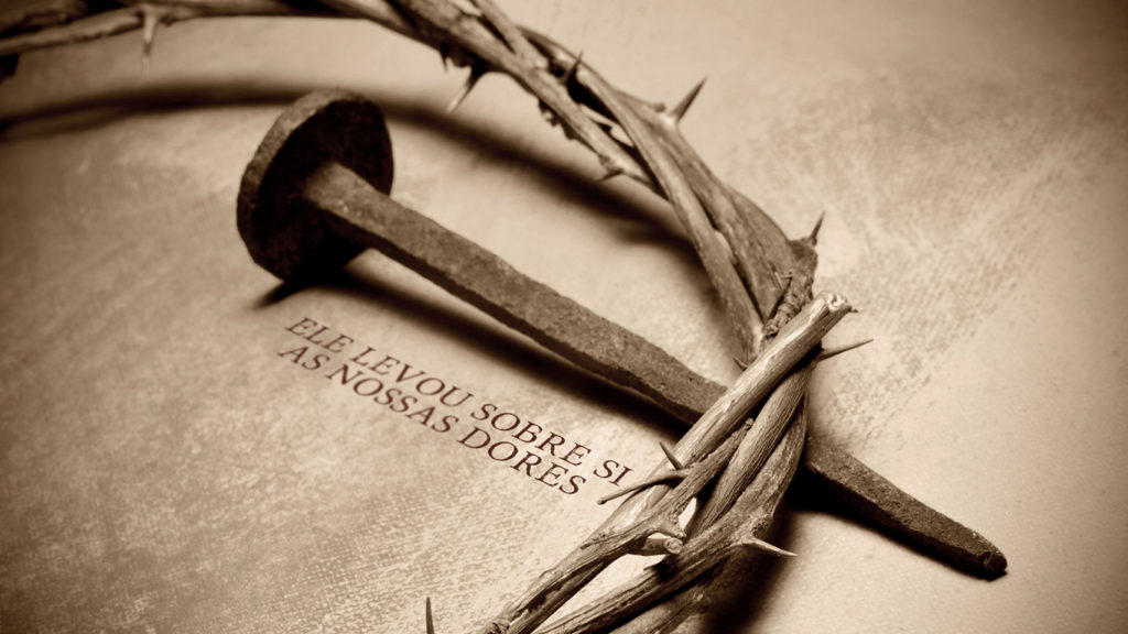 closeup of a representation of the Jesus Christ crown of thorns and nail representing his death, he could have escaped but did not.