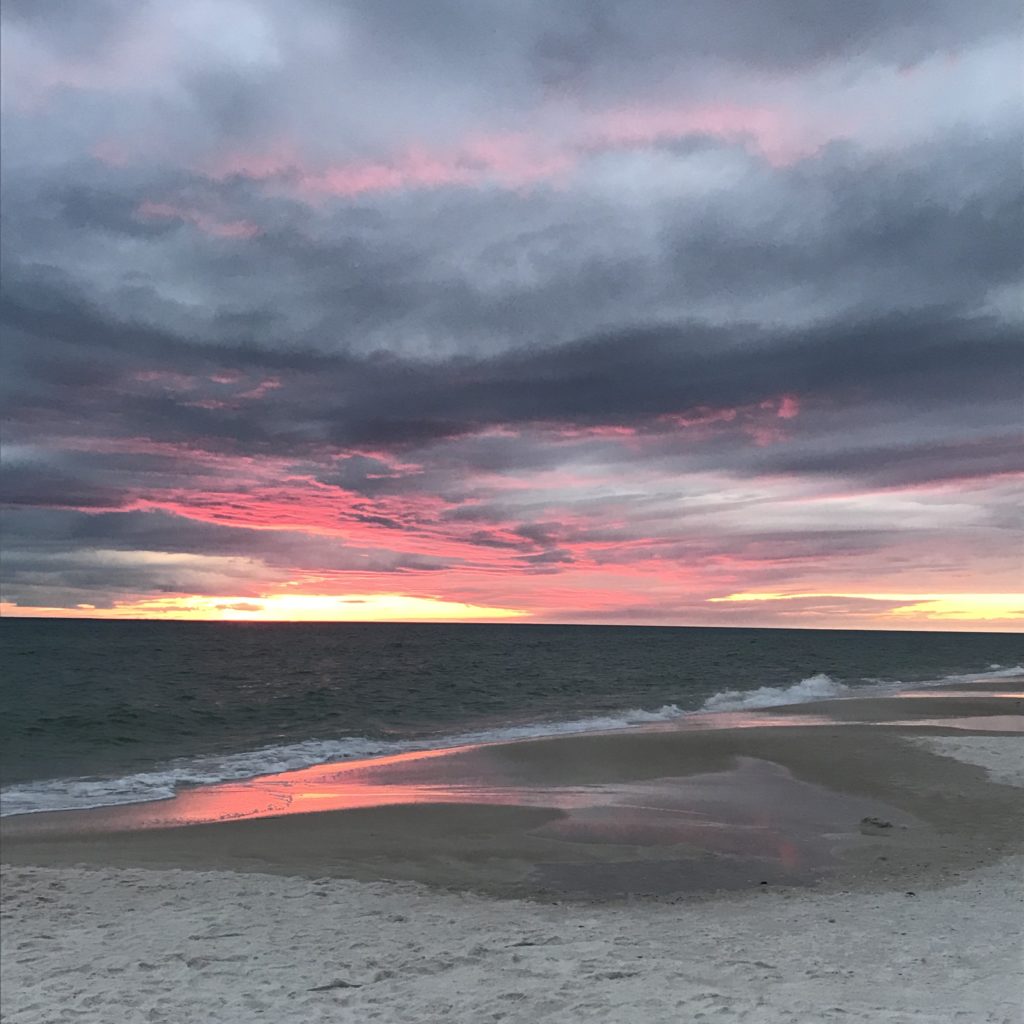 A colorful sunset picture taken over the Gulf representing the glory of God