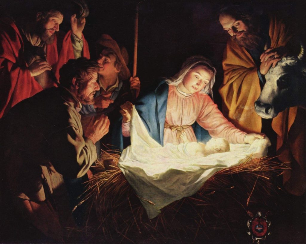 A picture of the nativity story, showing Mary, the baby, Joseph, and shepherds.