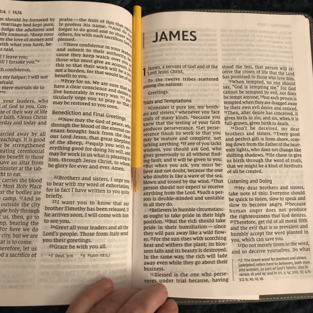 a picture of an open Bible, the letter of James.